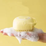 Yellow silicone bath brush and massager for dogs