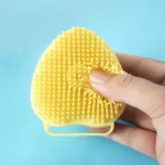 Yellow silicone bath brush and massager for dogs